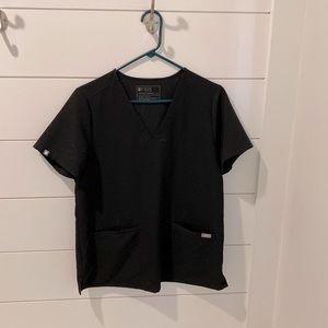 Woman’s figs scrubs size medium with two pockets in the front